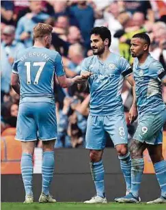  ?? Foto: AFP ?? Ilkay Gündogan (M.) trifft gleich doppelt für Manchester City.