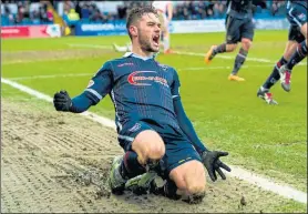  ??  ?? ROARING: Ross County’s Alex Schalk celebrates putting his side ahead