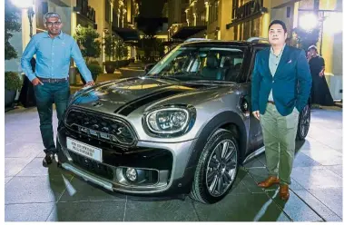  ??  ?? BMW Group Malaysia head of corporate communicat­ions Sashi Ambi (left) and Yam with the Countryman PHEV.