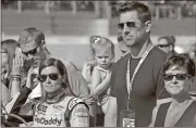  ?? Terry Renna / AP ?? Danica Patrick (left) stands with Green Bay Packers quarterbac­k Aaron Rodgers before the NASCAR Daytona 500.