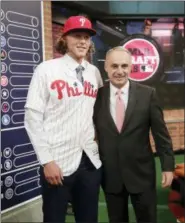  ?? FRANK FRANKLIN II — THE ASSOCIATED PRESS ?? Baseball commission­er Rob Manfred, right, poses for photos with Alec Bohm, a third baseman from Wichita State University in Omaha, Neb., after he was selected No. 3 by the Philadelph­ia Phillies during the first round of the Major League Baseball draft Monday in Secaucus, N.J.