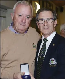  ??  ?? Peter Higgins, Gents Captain at Seapoint, presents Bernard Serry with a medal for his score of Nett 65.