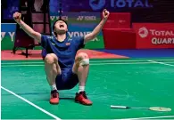  ?? AFP ?? China’s Shi Yuqi celebrates after beating Lin Dan. —
