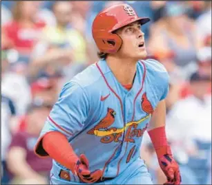  ?? AP ?? Cardinals’ Nolan Gorman watches the ball after hitting the second of four straight St. Louis home runs during the first inning in Philadelph­ia.