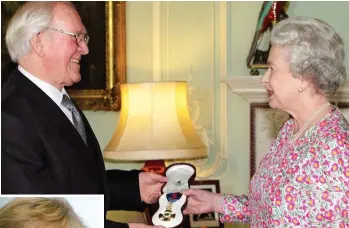  ??  ?? Honour: Sir James receives Order of Merit from Queen