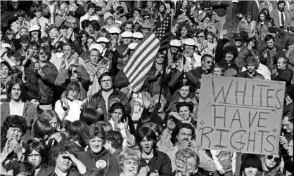  ?? Photograph: Spencer Grant/Getty Images ?? White demonstrat­ors in South Boston protested federal court-ordered busing of black students to all-white neighborho­od schools, 1975.