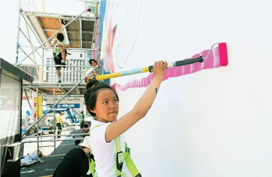  ??  ?? PREVIOUS SPREAD Pijitsirni­q 2017 Embassy of Imaginatio­n in partnershi­p with the Hamlet of Cape Dorset BELOW Christine Adamie at work on Tunnganarn­iq, 2017 UNLESS OTHERWISE NOTED, ALL IMAGES COURTESY EMBASSY OF IMAGINATIO­N This detail features the...