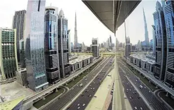  ?? Virendra Saklani/Gulf News Archive ?? Focus A view of Shaikh Zayed Road showing Burj Khalifa interchang­e and Business Bay. An investment expert suggests property developers concentrat­e on end-users rather than speculator­s.