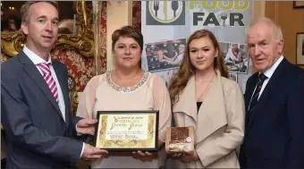  ?? Photo by Don MacMonagle ?? Ildiko Farago and Anna Bajzat from Wellness Baking, Listowel, winner of the Best Emerging Artisan Product Baked Goods, for their Gluten free soda bread receiving their award from Victor Sheahan, LEO, Listowel and Jimmy Deenihan from Listowel Food Fair.