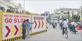  ?? DEEPAK GUPTA / HT PHOTO ?? City’s new selfie spot: Two girls pose for a selfie at the metro constructi­on site in Hazratganj on Wednesday.