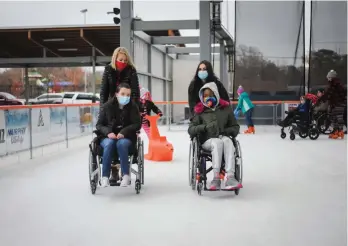  ?? (Contribute­d) ?? Kristi Lowery, right, president and CEO of HOPE Landing, skates on the ice with Madison Livingston, left, alumna of HOPE and organizer of the skate parties.