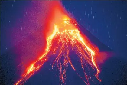 ?? Picture / AP ?? Mt Mayon’s daytime eruptions have plunged nearby villages into darkness.