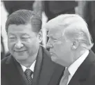 ?? ANDREW HARNIK/AP ?? Presidents Trump and Xi in Beijing last November.