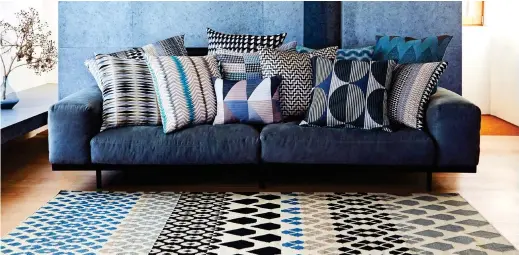  ??  ?? Pleasing pattern: Cushions and Iceni Kelim rug by Margo Selby. Inset: Raw coral fabric by Tibor, £186 per metre