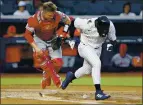  ?? NOAH K. MURRAY — THE ASSOCIATED PRESS ?? Angels catcher Max Stassi goes after the ball before throwing out the Yankees’ Jonathan Davis in the second inning Monday in New York.