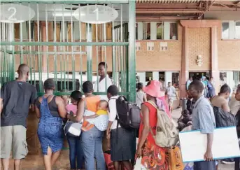  ??  ?? Travellers go through Zimra customs formalitie­s at Beitbridge Border Post yesterday