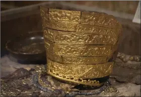  ?? (AP/Efrem Lukatsky) ?? A fourth century B.C. golden ceremonial headgear, an ancient treasure from a Scythian king’s burial mound, is exhibited in the Museum of Historical Treasures last month in Kyiv, Ukraine.