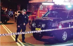  ??  ?? SYDNEY: Police man guards a check point in the Sydney inner suburb of Surry Hills. —AFP