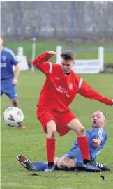  ??  ?? All action Mark Brash slides in for a tackle