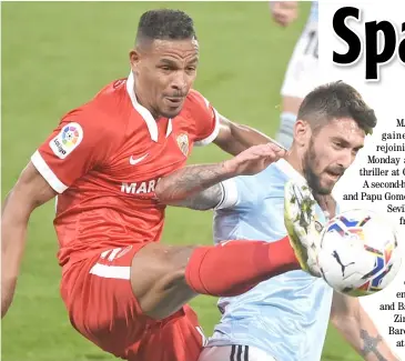  ?? MIGUEL RIOPA/AGENCE FRANCE-PRESSE ?? FERNANDO Reges of Sevilla (left) gets the upperhand in the battle for the ball against Facundo Ferreyra of Celta Vigo.