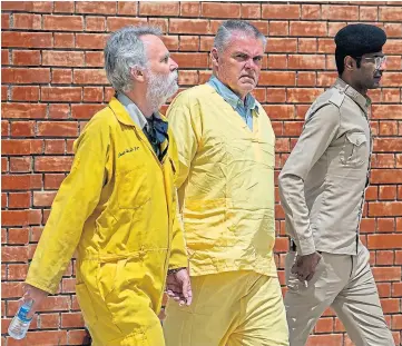  ?? ?? TRIAL: Jim Fitton, left, and German Volker Waldman at court in Baghdad.