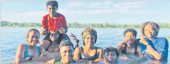  ?? Picture: FIJI FA MEDIA ?? Tailevu Naitasiri players uses the Rewa River to do
their therapy.