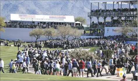  ?? DARRYL WEBB VIA AP ?? GOLF FANS MAKE THEIR WAY AROUND THE COURSE during the Phoenix Open golf tournament Friday in Scottsdale.