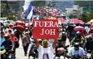  ?? Photograph: Orlando Sierra/AFP/ Getty Images ?? Hundreds demonstrat­e to demand the resignatio­n of Hernández for his alleged links with drug traffickin­g, in Tegucigalp­a in 2019.