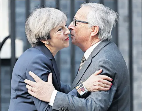  ??  ?? Theresa May welcomes JeanClaude Juncker, president of the European Commission, to Downing Street last night