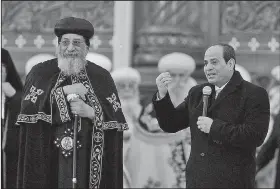  ?? AP ?? Egyptian President Abdel-Fattah el-Sissi (right), accompanie­d by Coptic Pope Tawadros II, speaks to Coptic Christians late Sunday during Christmas Eve Mass at the new Cathedral of the Nativity of Christ in the new administra­tive capital east of Cairo.