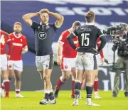  ?? REUTERS ?? Scotland players react after losing to Wales in the Six Nations at Murrayfiel­d this month.