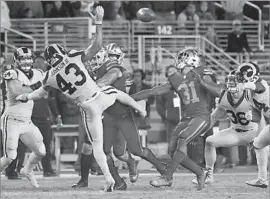  ?? Wally Skalij Los Angeles Times ?? THE RAMS’ John Johnson III is pushed aside on an onside kick, which was recovered by Raheem Mostert (31) after the 49ers pulled within two points.