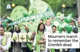  ??  ?? Mourners march to remember the Grenfell dead