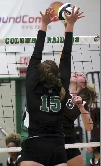  ?? RANDY MEYERS — FOR THE MORNING JOURNAL ?? Wellington’s Brooke Lehmkuhl taps the ball over Columbia’s Gabby Zapola during the first game Sept. 7.