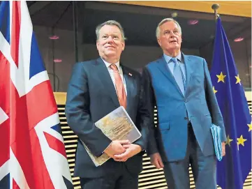  ??  ?? TENSE: The UK’s negotiator David Frost, left, and EU counterpar­t Michel Barnier.