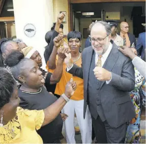  ?? (Photo: Garfield Robinson) ?? Opposition Leader Mark Golding greets supporters outside Parliament after making his presentati­on in the 2023/24 Budget Debate, Tuesday.