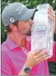  ??  ?? Webb Simpson celebrates winning The Players Championsh­ip in Florida on Sunday.