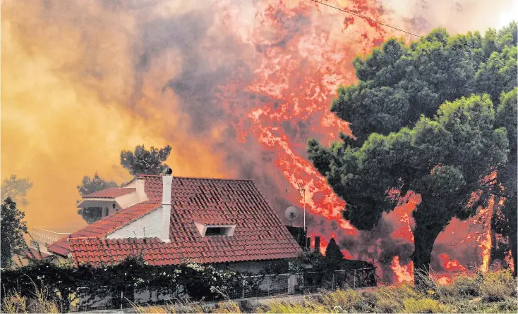  ?? Pictures: PANTELIS SAITAS/EPA, VALERIE GACHE/AFP, COSTAS BALTAS/REUTERS ?? Flames consume a villa in Kineta near Athens. People fled into the sea at Mati to escape the fast-moving fires, while clouds of smoke billowed over Neo Voutsa, a suburb of the Greek capital