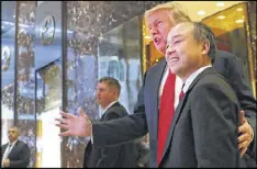  ?? SPENCER PLATT / GETTY IMAGES ?? President-elect Donald Trump and SoftBank CEO Masayoshi Son announce that SoftBank has agreed to invest $50 billion in the United States and create 50,000 new jobs.