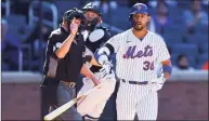  ?? Mike Stobe / TNS ?? Michael Conforto (30) of the New York Mets celebrates after being hit by a pitch with the bases loaded to force in the winning run in the bottom of the ninth inning against the Miami Marlins at Citi Field on Thursday in New York.