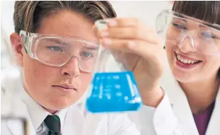  ??  ?? Top: Kenneth Pinkerton, senior associate with Turcan Connell; above: pupils listening in the classroom and, left, carrying out science experiment­s.