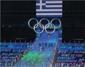  ?? XU ZIJIAN / XINHUA ?? The Olympic delegation of Greece leads the atheletes parade into the National Stadium during the opening ceremony.