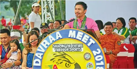  ??  ?? DON'T GIVE UP. Keynote speaker Manny Pacquiao reminds athletes to always stay positive and never give up no matter how difficult the challenges they face in life during the opening of the Davraa Meet 2018 opening at the University of Mindanao (UM)...