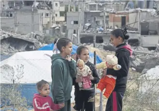  ?? PICTURE: AFP VIA GETTY IMAGES ?? Children at a makeshift camp housing displaced Palestinia­ns in Rafah, southern Gaza