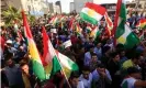  ??  ?? Iraqi Kurds wave flags of Iraqi Kurdistan and shout slogans during a demonstrat­ion outside the UN Office in Erbil. Photograph: Safin Hamed/AFP/ Getty Images