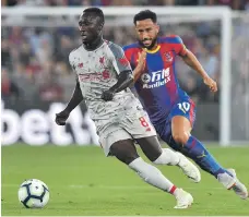  ?? AFP ?? Liverpool’s Naby Keita shows a clean pair of heels to Andros Townsend of Crystal Palace on Monday night