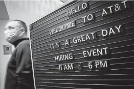  ?? Smiley N. Pool / Dallas Morning News ?? Job candidates attend an AT&T hiring event in April in Richardson. The company was hiring for 300 jobs across the Dallas-Fort Worth area in retail, virtual sales and customer acquisitio­n roles.