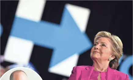  ?? JEWEL SAMAD/AFP/GETTY IMAGES ?? The iconic “H” created for Hillary Clinton’s presidenti­al campaign was created by graphic designer Michael Bierut, left.