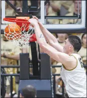  ?? DOUG MCSCHOOLER / ASSOCIATED PRESS ?? Purdue center Zach Edey (15) dunks the ball March 2 against Michigan State in West Lafayette, Ind. Edey will try to lead the Midwest Region’s No. 1 seed to its first Final Four in coach Matt Painter’s tenure.