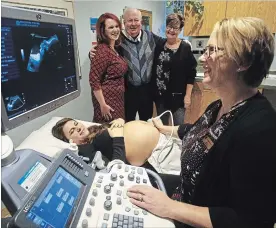  ?? CLIFFORD SKARSTEDT EXAMINER ?? Veronica Lvinskyi does an ultrasound with sonographe­r Carol Horner as Family Health Team Foundation executive director Laura Kennedy, lead physician Dr. Bob Neville and manager Cheryl Collins, diagnostic services, look on Tuesday during at the Medical Centre.